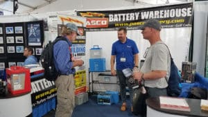 A boatowner discusses electrical storage products with a battery dealer.