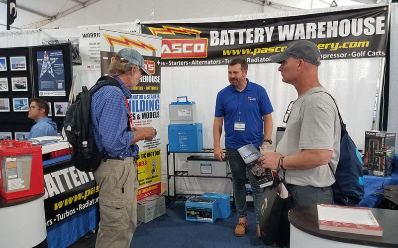 A boatowner discusses electrical storage products with a battery dealer.