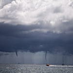 Heavy weather, like this squall with a waterspout, will be the subject of an upcoming National Hurrican Center online seminar.