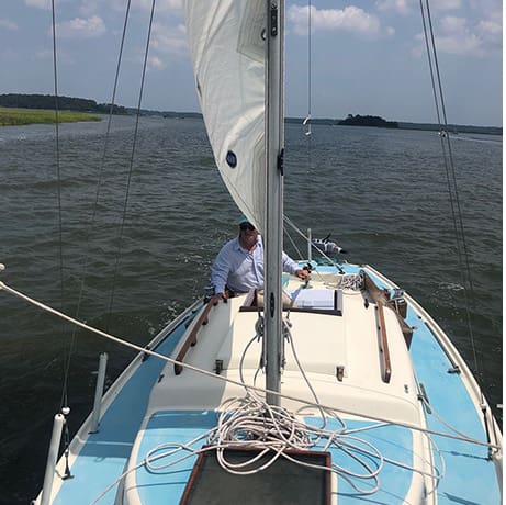 James Borton aboard his Pearson Electra Sea Gypsy catching the wind on the May River in South Carolina.