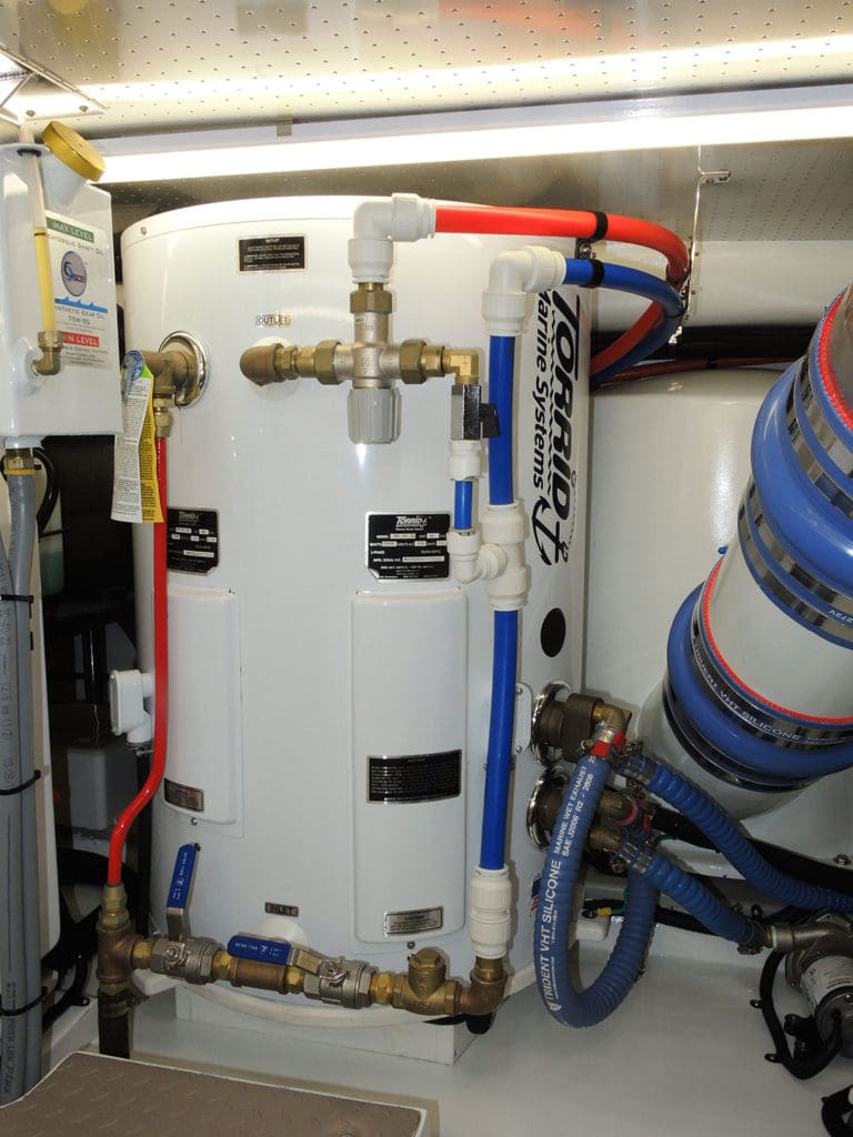 Vertical water heaters, especially larger ones used in offshore passage making vessels, benefit from support at both the top and bottom 