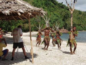 Luc and Jackie filming local performers in Vanuatu.