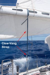 The clew-vang strap is led outboard to the toe rail. 