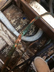 The corroded fuel line that was dumping diesel into the bilge.