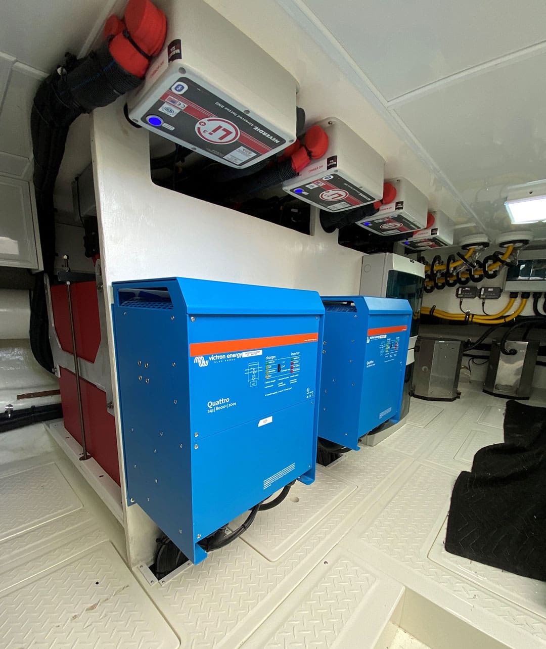 Two battery chargers/inverters and above those, four battery management system units for lithium batteries.