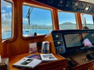 Voyage planning books in Gratitude’s pilothouse.