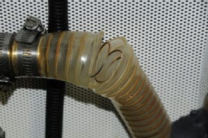 Most clear PVC hose, even when wire reinforced, is not rated for pressurized raw water, as is evidenced by this failure.