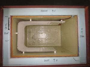 This cold box shows an evaporator plate with stand offs. Note tightly-fitted blue solid insulation.