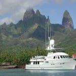 The Northern Marine 75 Starr at Hakahau in the Marquesas, with owners Sharry and Don Stabbert on the bow.