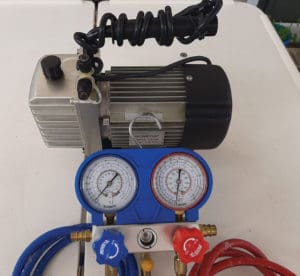  R134a refrigeration gauges and a small 
vacuum pump.
