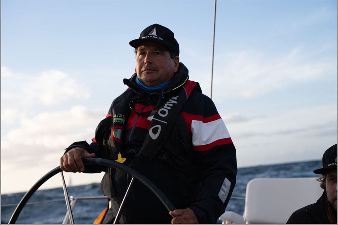 Micheal Marion at the helm of his boat Insoumise.