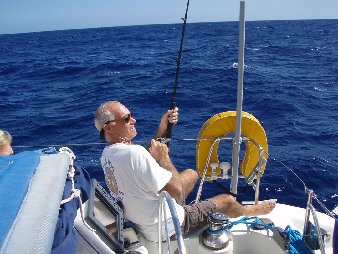 David enjoying some ocean fishing from Tortuguita’s cockpit while underway.