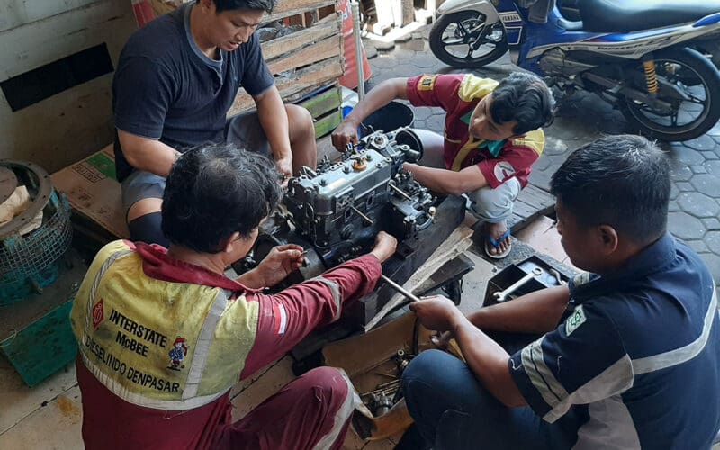 A crew of Indonesion mechanics works on one of the McCampbell’s diesels.