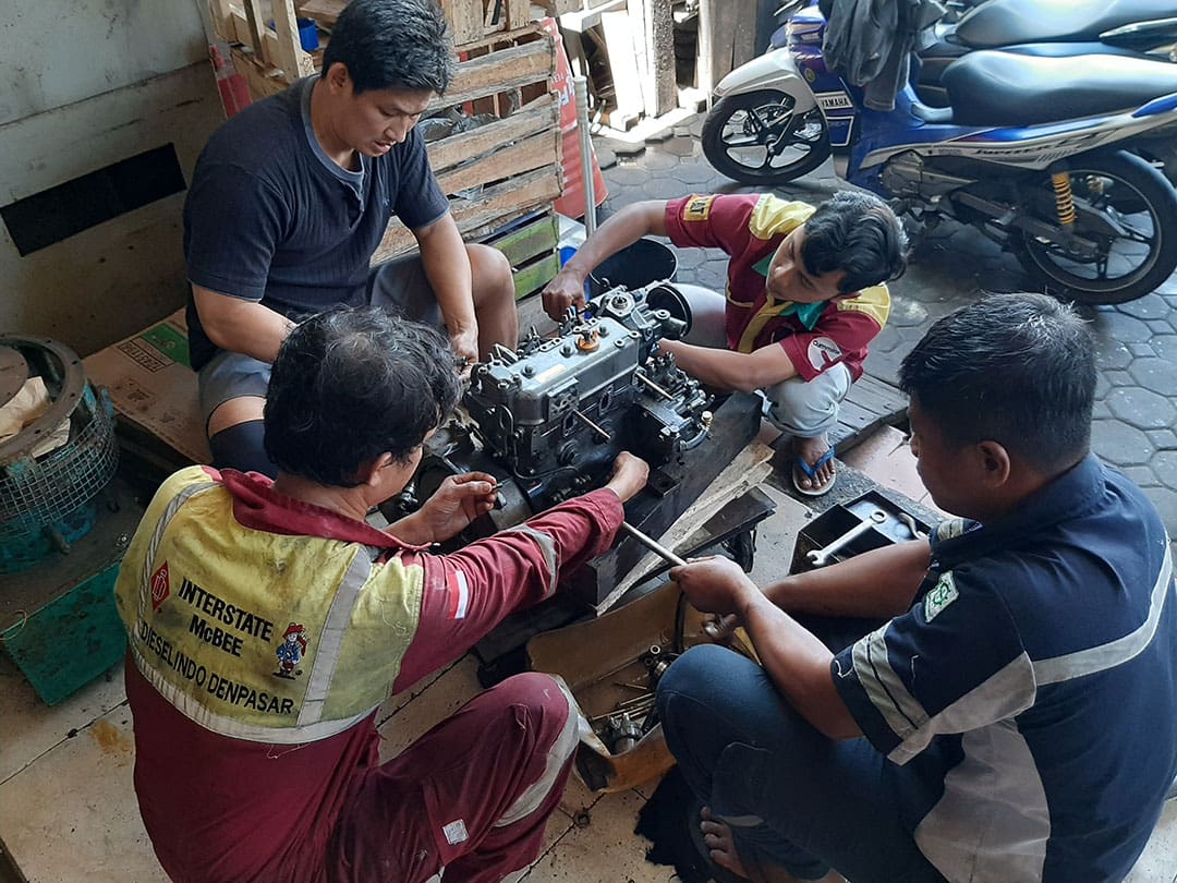 A crew of Indonesion mechanics works on one of the McCampbell’s diesels.