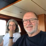 The voyaging couple in the Nordhavn’s pilothouse.
