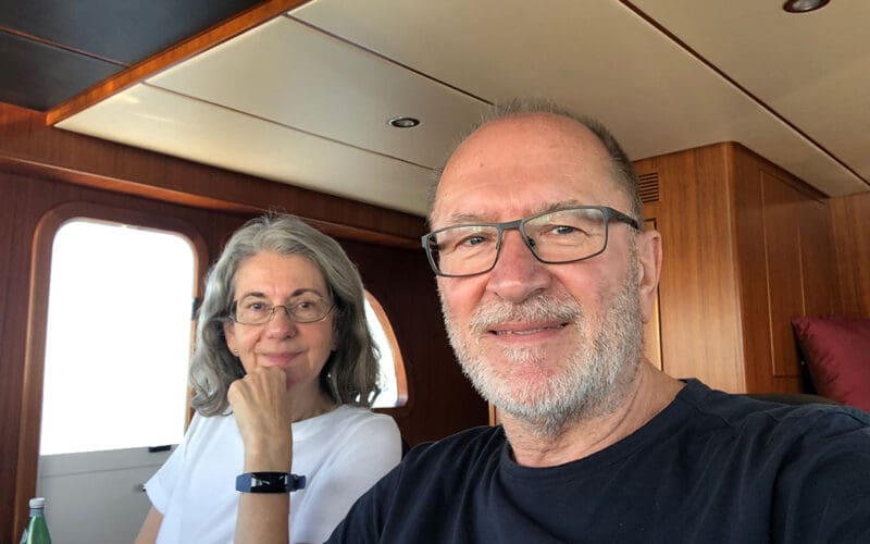 The voyaging couple in the Nordhavn’s pilothouse.