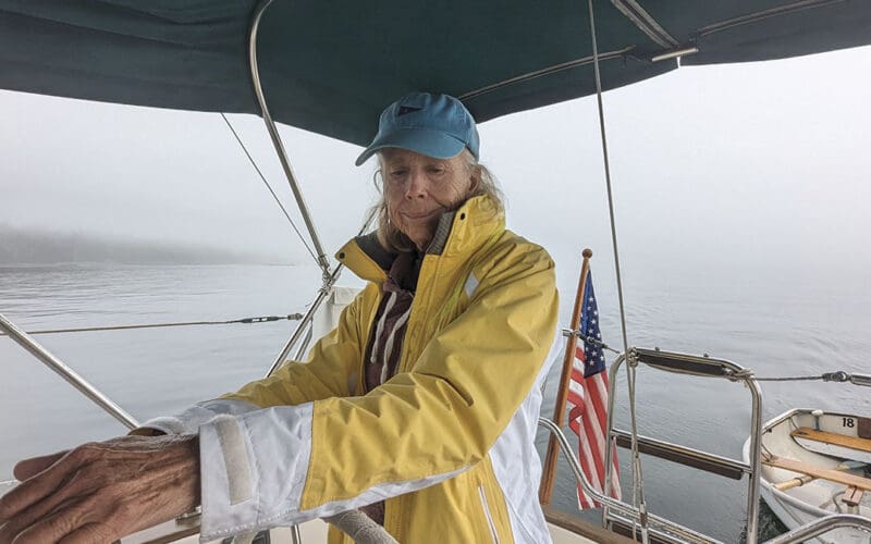 Ann Hoffner steering while being prompted by data from the chartplotter.