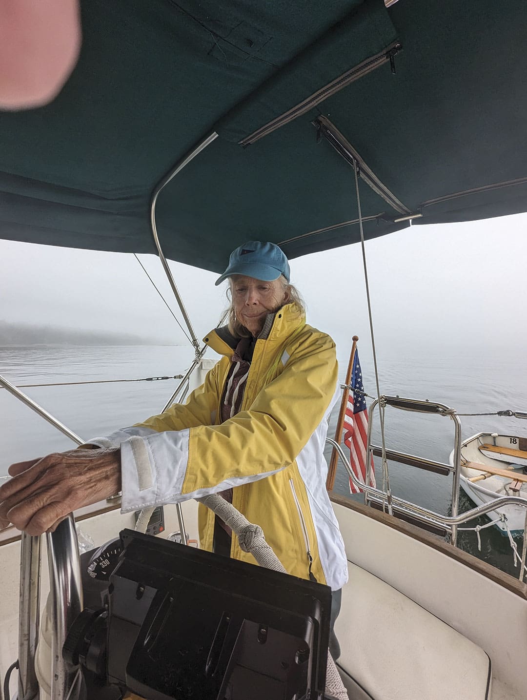 Ann Hoffner steering while being prompted by data from the chartplotter.