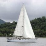 Oddly Enough, Ann and Tom Hoffner’s Peterson 44, under sail in Fiji.