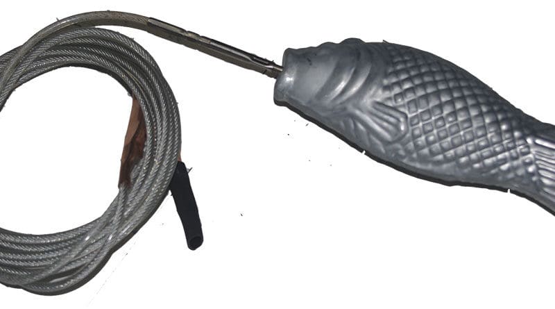 A zinc “fish anode” hanging in the water and connected to the boat’s bonding system helps to prevent corrosion damage from shore power.